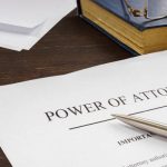 Power of attorney POA legal document and pen.